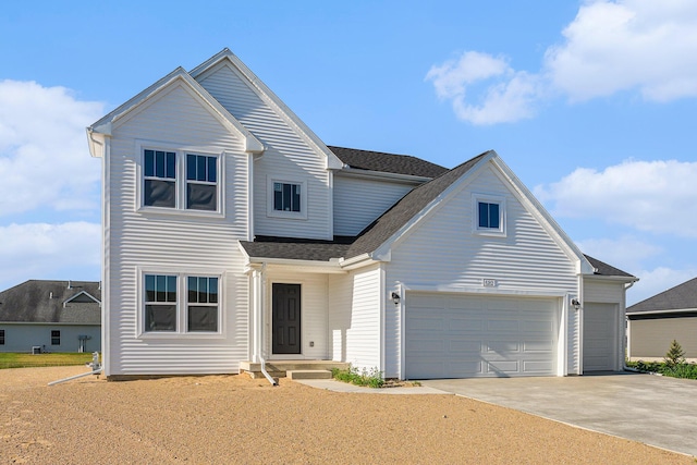 6182 Longhorn Trl, Stevensville, MI 49127 - traditional-style house with driveway, an attached garage, and a shingled roof
