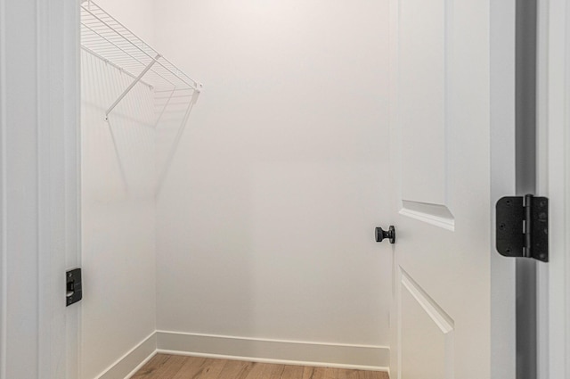 6182 Longhorn Trl, Stevensville, MI 49127 - walk in closet featuring light wood-style floors