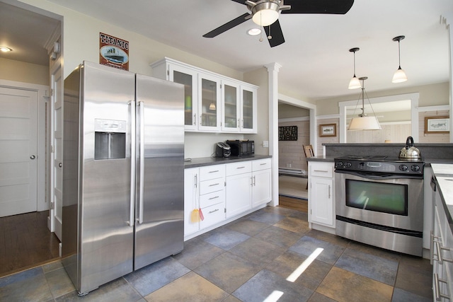 2177 S Lakeshore Dr, Ludington, MI 49431 - kitchen featuring appliances with stainless steel finishes, ceiling fan, dark countertops, glass insert cabinets, and white cabinetry