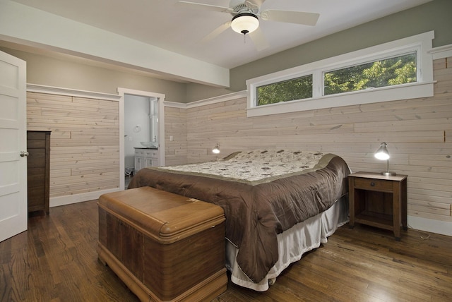 2177 S Lakeshore Dr, Ludington, MI 49431 - bedroom featuring wooden walls, dark wood finished floors, ensuite bath, and a ceiling fan