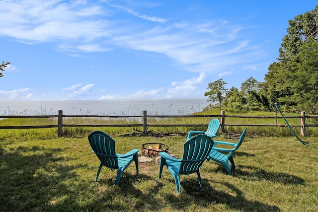 2177 S Lakeshore Dr, Ludington, MI 49431 - view of yard with a water view and a fire pit