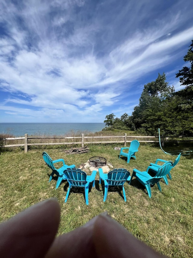 2177 S Lakeshore Dr, Ludington, MI 49431 - view of yard with an outdoor fire pit and a water view