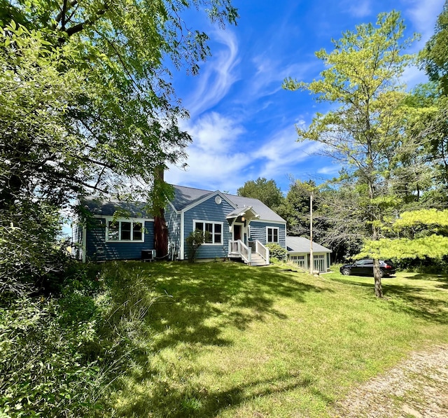 2177 S Lakeshore Dr, Ludington, MI 49431 - view of front facade with a front lawn