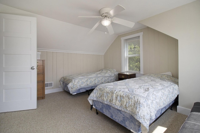 2177 S Lakeshore Dr, Ludington, MI 49431 - carpeted bedroom with vaulted ceiling and a ceiling fan
