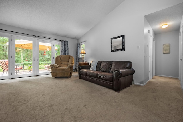 living area featuring carpet flooring, baseboards, french doors, and high vaulted ceiling
