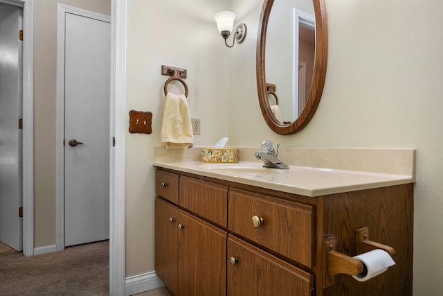 bathroom with vanity and baseboards