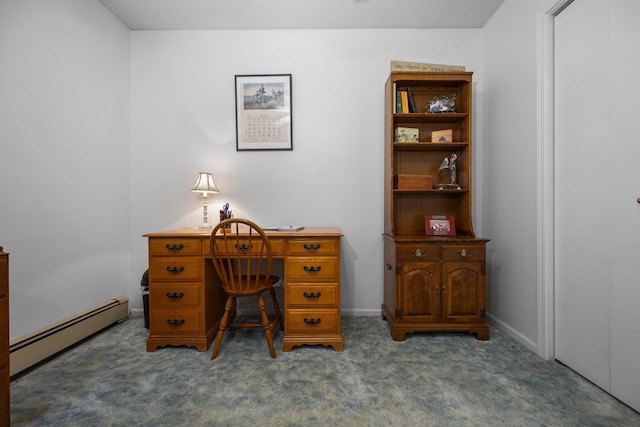 office space with baseboard heating, carpet floors, and baseboards