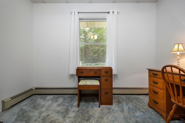 carpeted office space featuring a baseboard radiator
