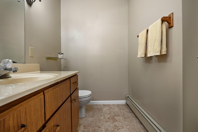 bathroom featuring a baseboard radiator, toilet, baseboards, and vanity