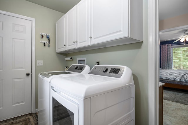 washroom with washer and dryer, cabinet space, and a ceiling fan