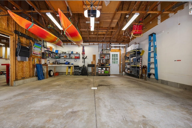 garage featuring a workshop area and a garage door opener