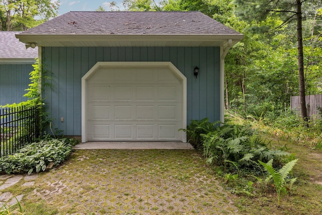 garage featuring fence
