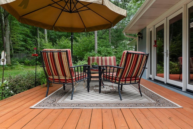 deck featuring french doors and outdoor dining space