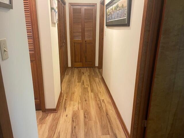 5410 Country Aire Dr Unit 14, Coloma, MI 49038 - corridor featuring light wood-style floors
