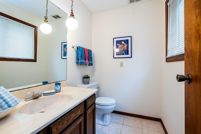5410 Country Aire Dr Unit 14, Coloma, MI 49038 - half bath featuring toilet, vanity, tile patterned flooring, and baseboards
