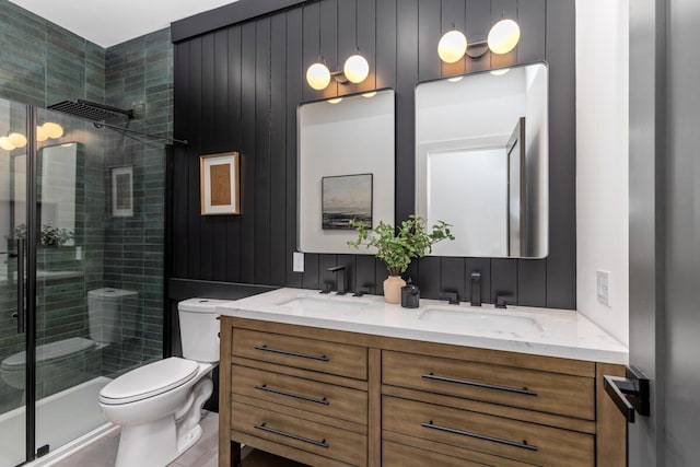 3500 Lakeshore Dr, Saint Joseph, MI 49085 - full bathroom with a stall shower, toilet, and double vanity