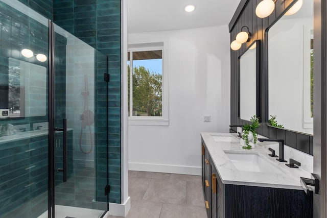 3500 Lakeshore Dr, Saint Joseph, MI 49085 - bathroom with a shower stall, baseboards, double vanity, tile patterned flooring, and recessed lighting