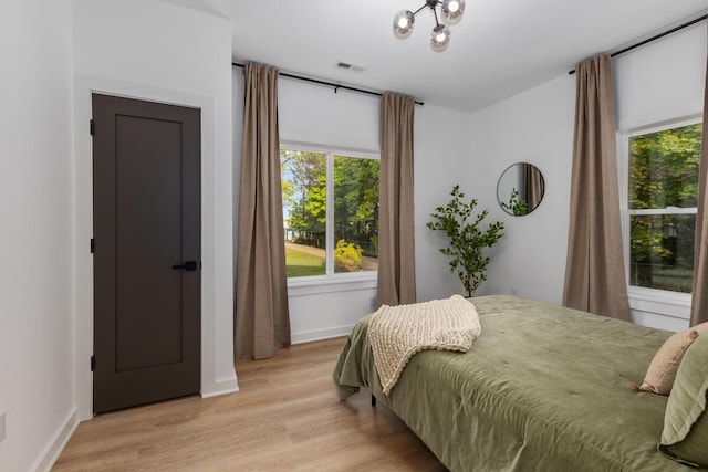 3500 Lakeshore Dr, Saint Joseph, MI 49085 - bedroom with light wood-type flooring and baseboards