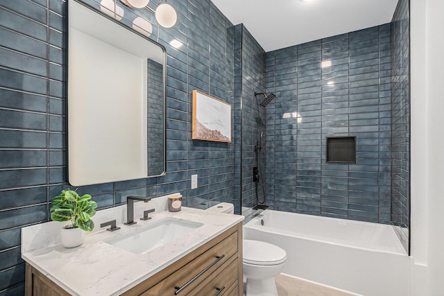3500 Lakeshore Dr, Saint Joseph, MI 49085 - bathroom with toilet, vanity, tile patterned flooring, shower / bath combination, and tile walls