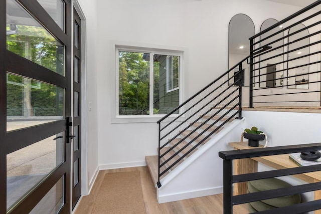3500 Lakeshore Dr, Saint Joseph, MI 49085 - foyer entrance featuring stairs, wood finished floors, and baseboards