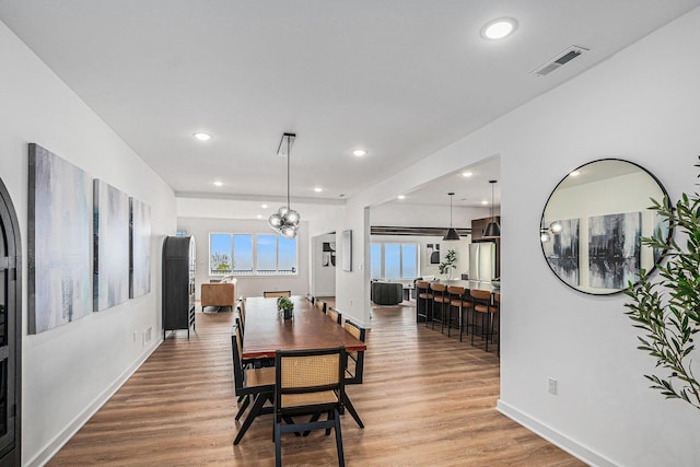 3500 Lakeshore Dr, Saint Joseph, MI 49085 - dining space with wood finished floors, baseboards, and recessed lighting