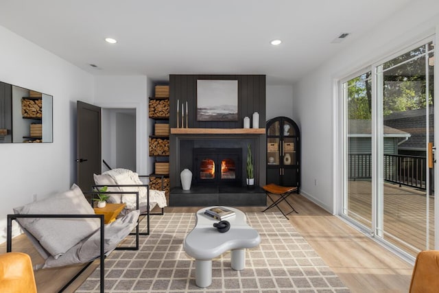 3500 Lakeshore Dr, Saint Joseph, MI 49085 - living area featuring wood finished floors, recessed lighting, and a fireplace