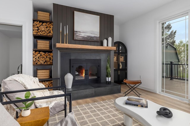 3500 Lakeshore Dr, Saint Joseph, MI 49085 - living room featuring wood finished floors and a glass covered fireplace