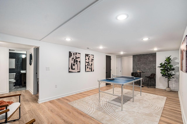 3500 Lakeshore Dr, Saint Joseph, MI 49085 - rec room with a fireplace, light wood-style flooring, baseboards, and recessed lighting