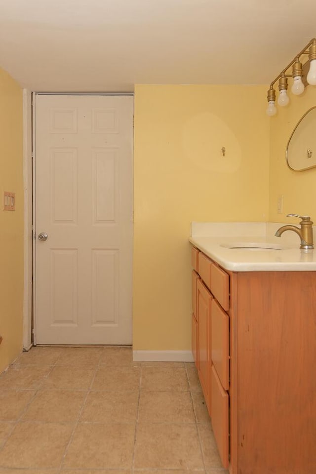 2106 Forest, Portage, MI 49002 - bathroom featuring vanity, tile patterned flooring, and baseboards