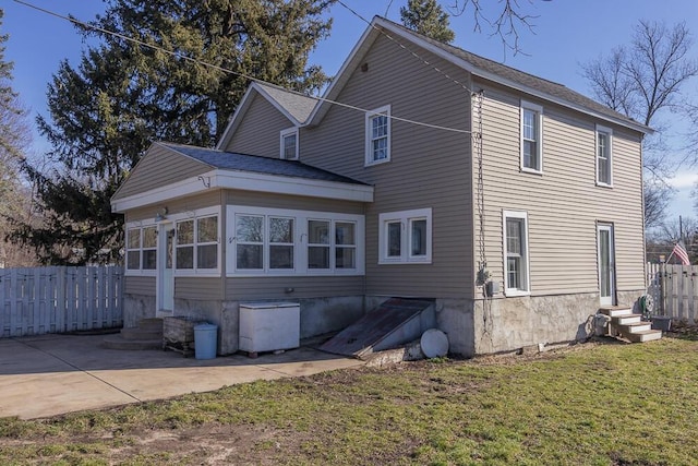2106 Forest, Portage, MI 49002 - back of house with entry steps and a patio area