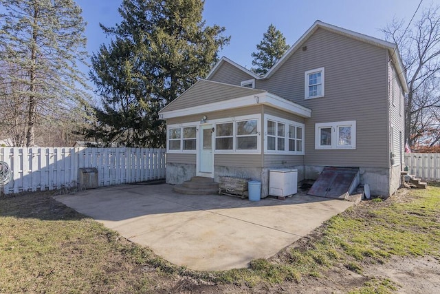 2106 Forest, Portage, MI 49002 - back of house featuring entry steps, fence, and a patio area