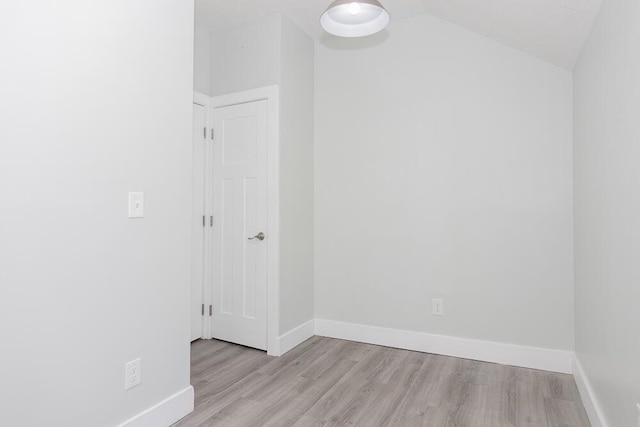 2106 Forest, Portage, MI 49002 - unfurnished room with wood finished floors, baseboards, and vaulted ceiling