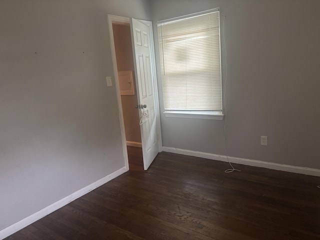 20100 Wexford St, Detroit, MI 48234 - empty room featuring dark wood-style flooring and baseboards