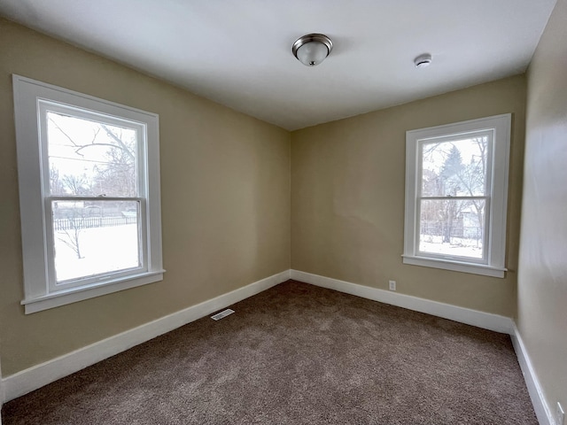 16254 Monica St, Detroit, MI 48221 - spare room with dark carpet, baseboards, and a smoke detector