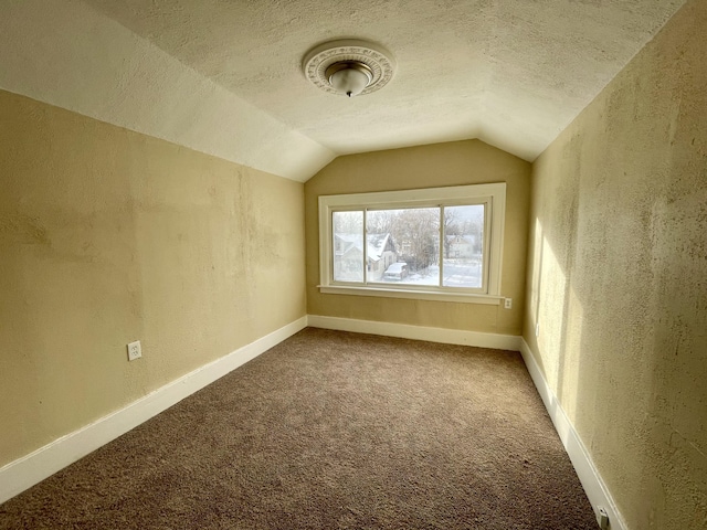 16254 Monica St, Detroit, MI 48221 - bonus room with a textured wall, vaulted ceiling, carpet flooring, a textured ceiling, and baseboards