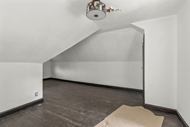 16634 Parkside St, Detroit, MI 48221 - additional living space with vaulted ceiling, baseboards, and wood finished floors