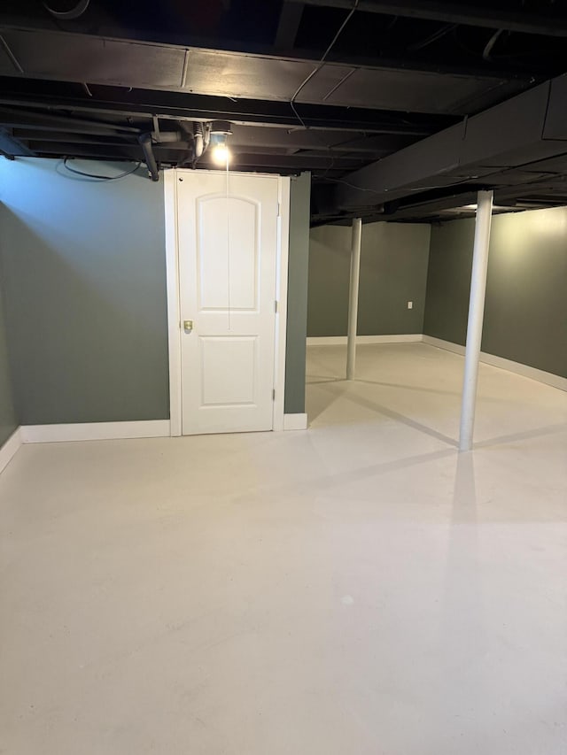 below grade area featuring baseboards