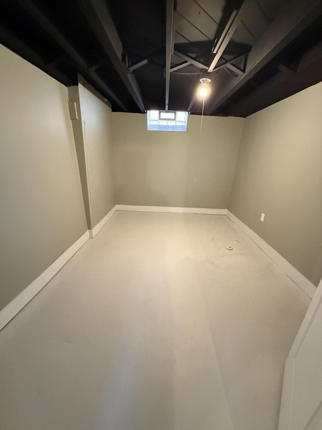 below grade area featuring baseboards