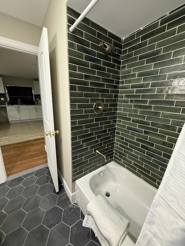 full bathroom featuring tile patterned flooring and shower / washtub combination