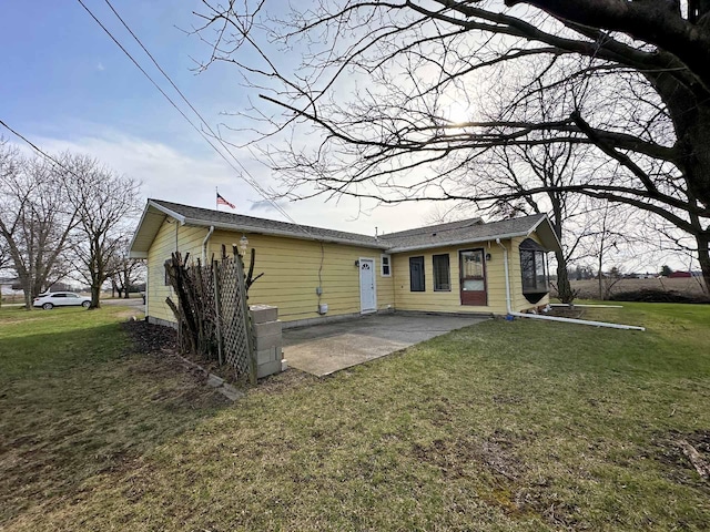 2565 Carleton Rockwood Rd, Carleton, MI 48117 - back of house featuring a patio area and a yard