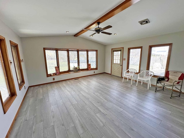 2565 Carleton Rockwood Rd, Carleton, MI 48117 - unfurnished living room with a ceiling fan, wood finished floors, and baseboards