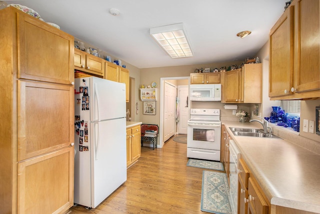 7343 Green Meadow Ln, Canton, MI 48187 - kitchen with white appliances, a sink, light wood-style flooring, and light countertops