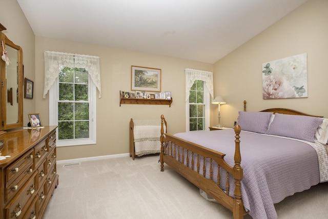 7343 Green Meadow Ln, Canton, MI 48187 - bedroom with baseboards, light carpet, and vaulted ceiling