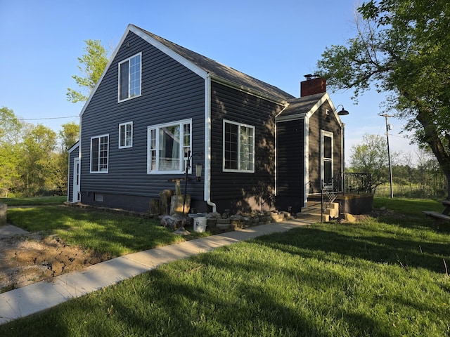13851 Hillsdale Rd, Camden, MI 49232 - view of side of property featuring a lawn and a chimney