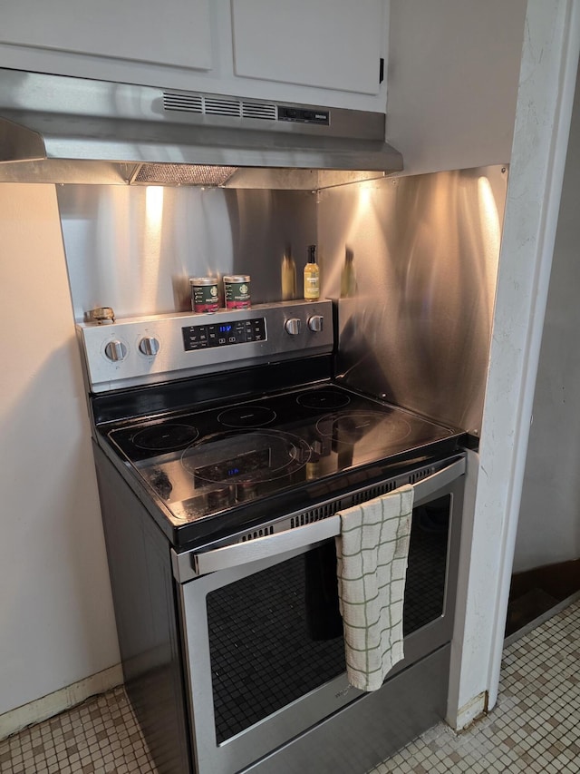 13851 Hillsdale Rd, Camden, MI 49232 - kitchen with stainless steel range with electric stovetop and under cabinet range hood