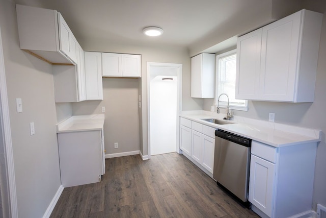 kitchen featuring dishwasher, a sink, dark wood-type flooring, and white cabinets