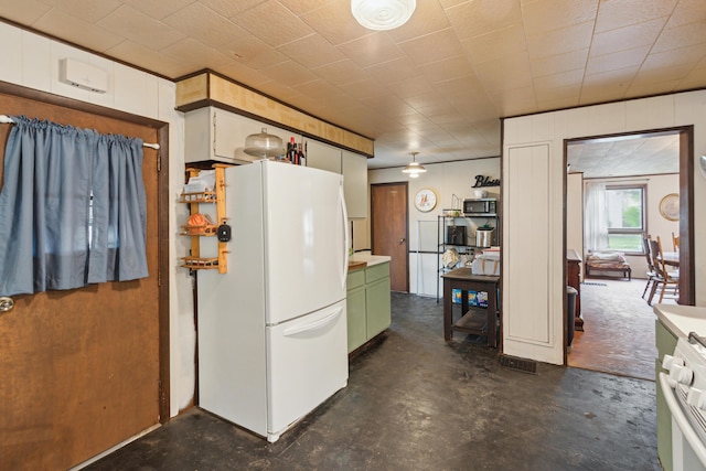 27 Hawley St, Quincy, MI 49082 - kitchen featuring white appliances, green cabinets, concrete floors, and light countertops
