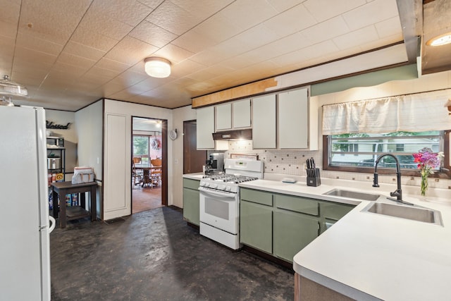 27 Hawley St, Quincy, MI 49082 - kitchen featuring white appliances, a sink, green cabinetry, concrete floors, and light countertops