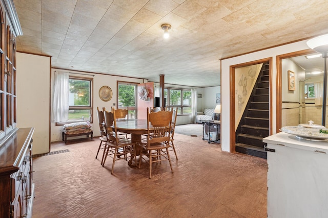 27 Hawley St, Quincy, MI 49082 - dining room featuring crown molding and stairs