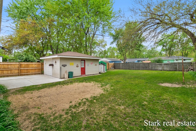 view of yard featuring an outbuilding and a patio